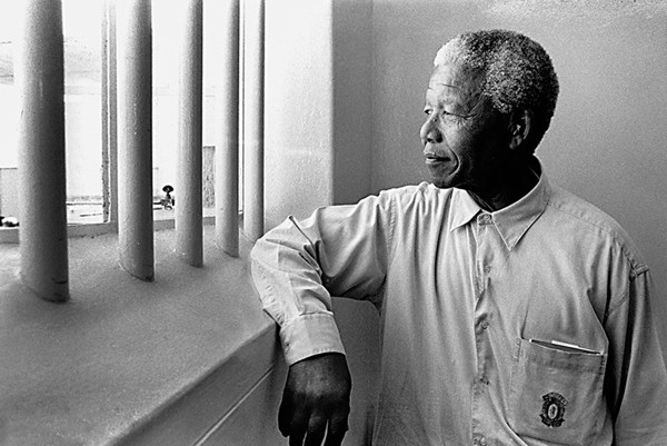 Jürgen Schadeberg "Nelson Mandela in his cell on Robben Island (revisit), 1994"