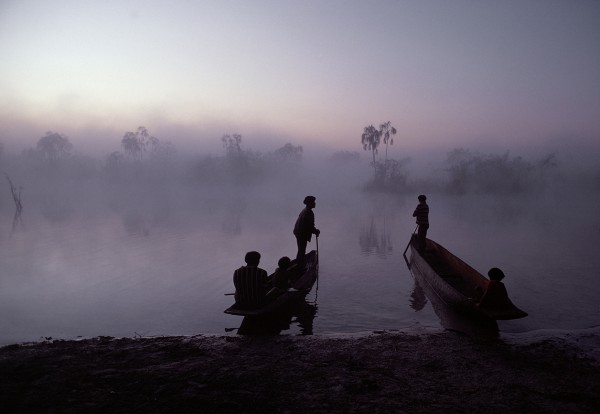 Michael Friedel "The Yawalapiti. Fishermen waiting for the sunrise, in the morning mist on the Tuatu