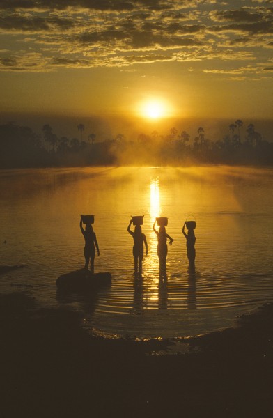 Michael Friedel "The Kuikuru. Kuluene river lagoon, upper Xingu. Women collecting water at sunrise."